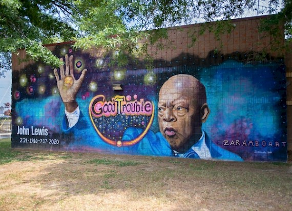 Colorful mural of civil rights leader John Lewis that says good trouble.